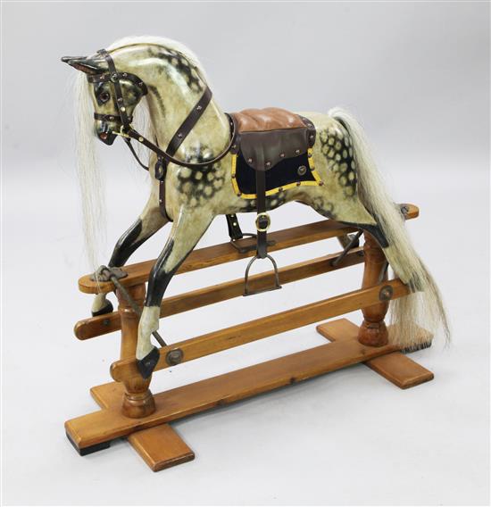 A small Edwardian painted wood rocking horse, H.2ft 10in. L.3ft 2in.